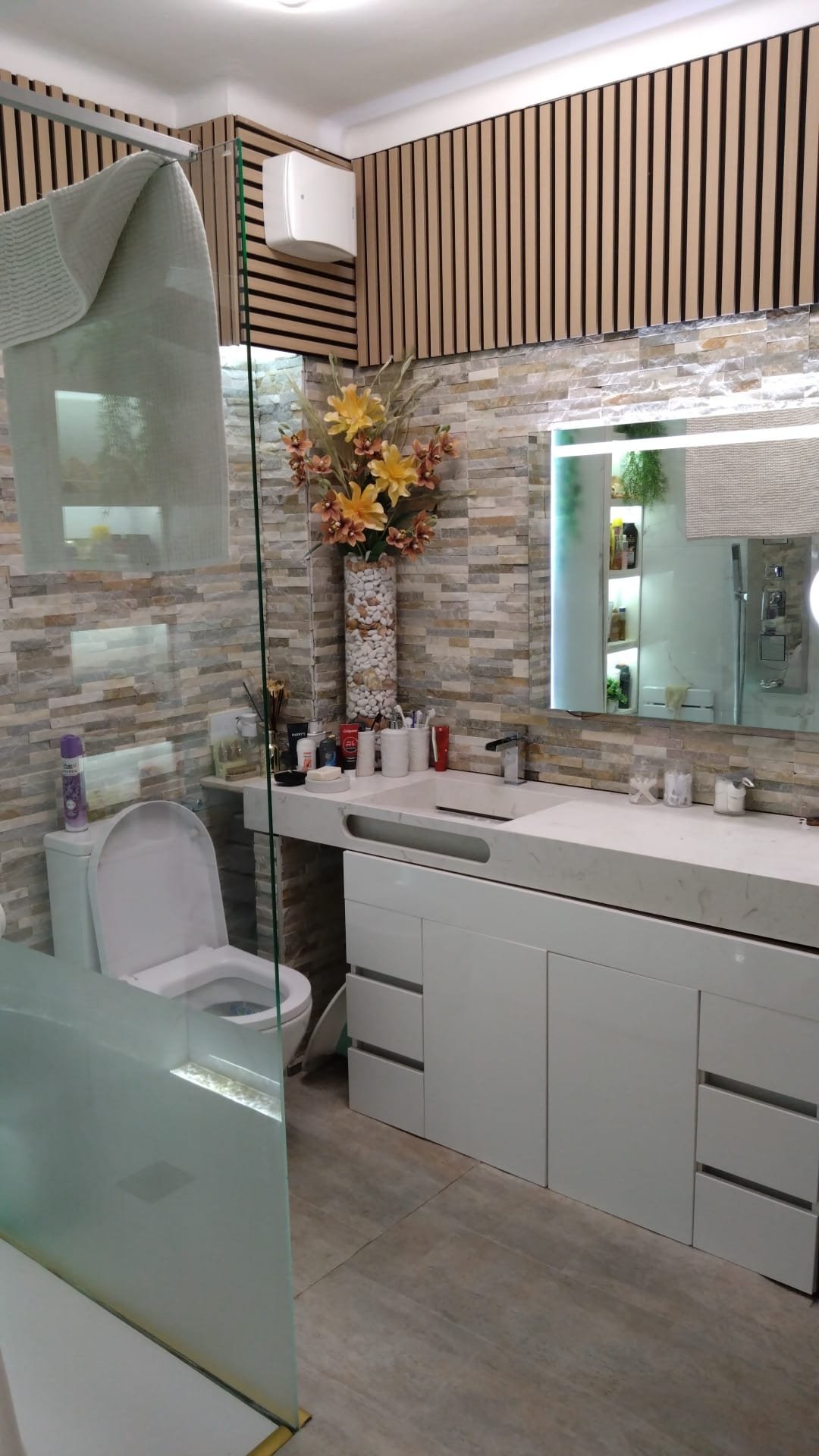 Bathroom with new illuminated mirror and electrical fittings