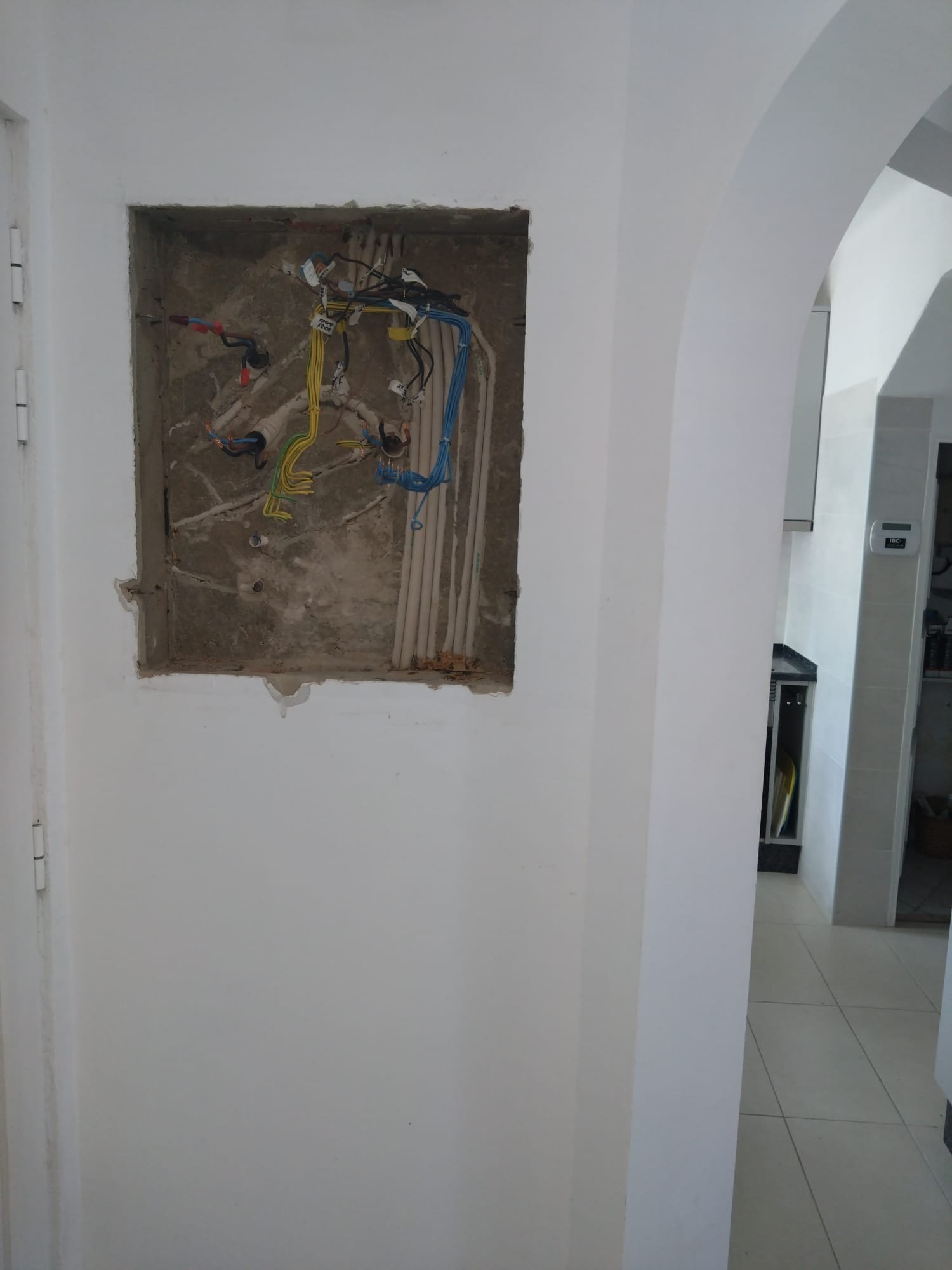 New consumer unit enclosure fitted into a prepared wall opening