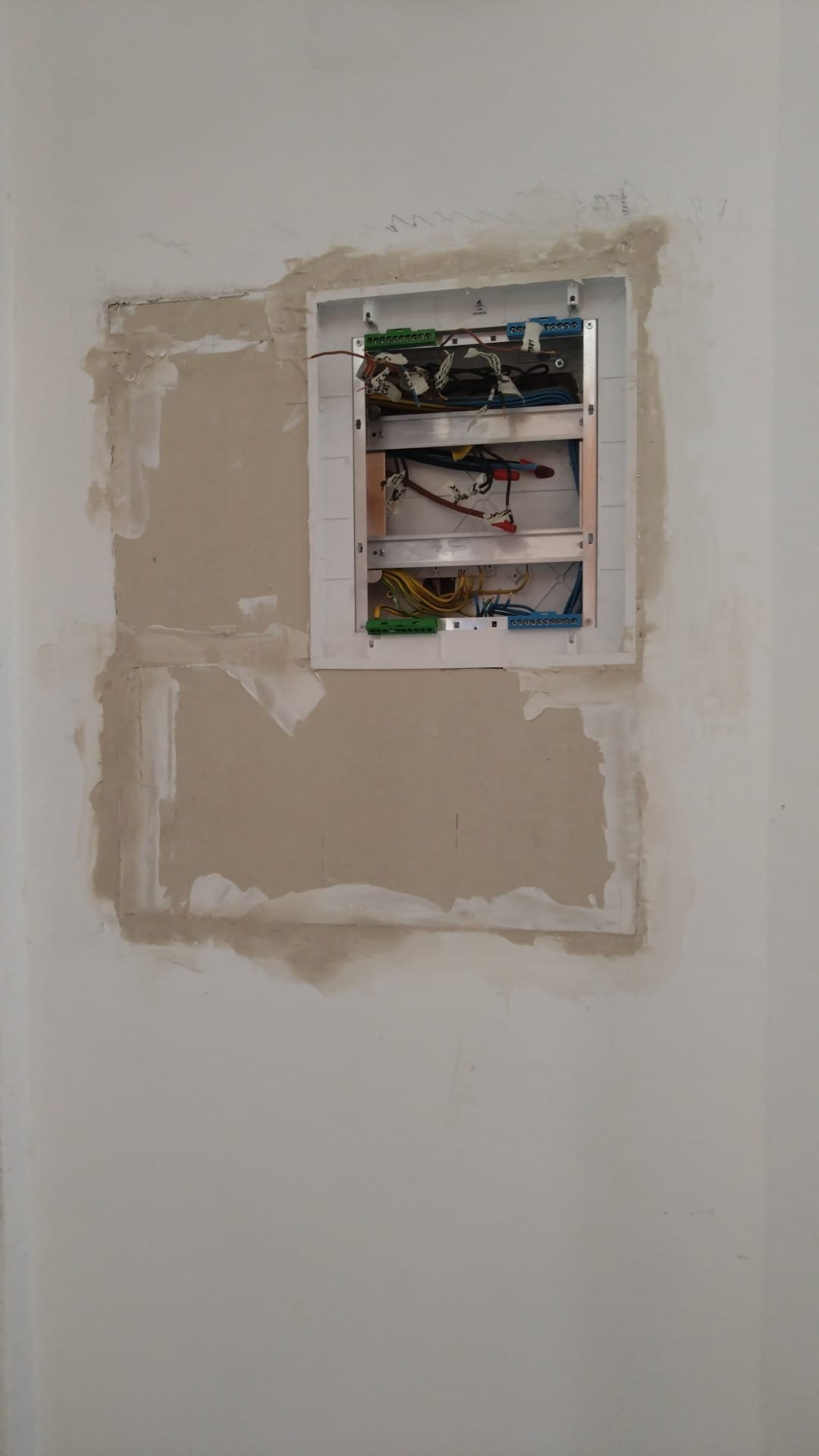Existing wiring exposed during a consumer unit upgrade