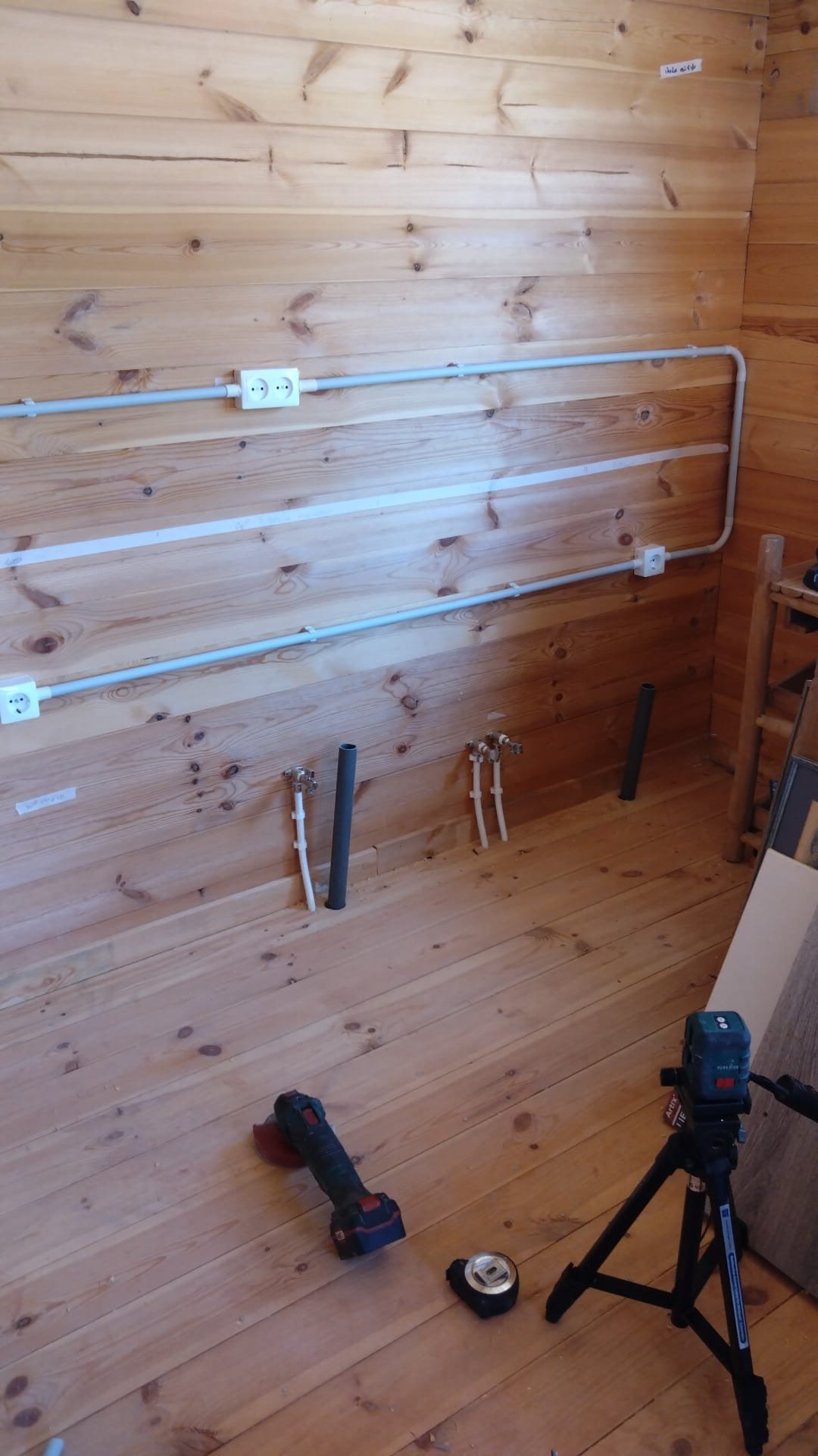 Electrical conduit and sockets installed in a timber room