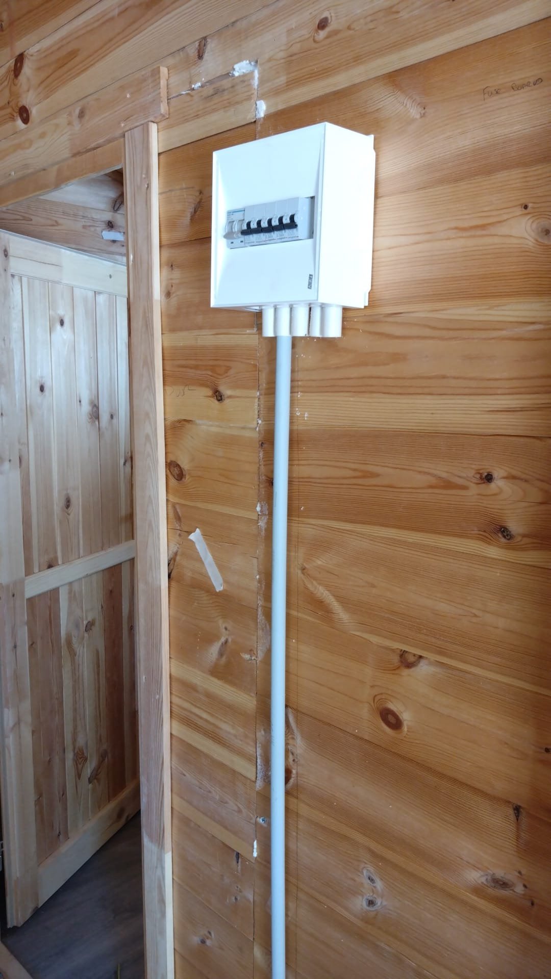 Consumer unit wiring exposed during an electrical upgrade