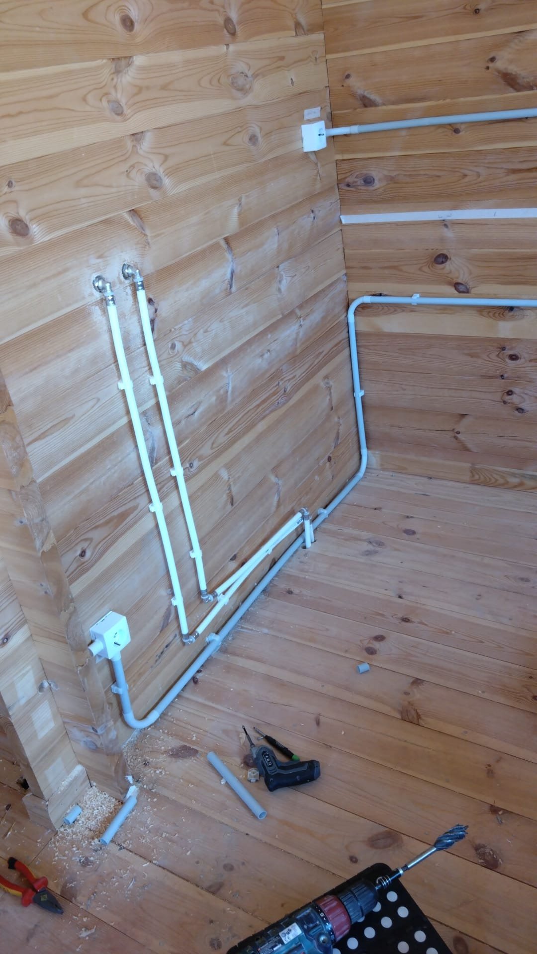 Electrical conduits and sockets fitted in a timber room
