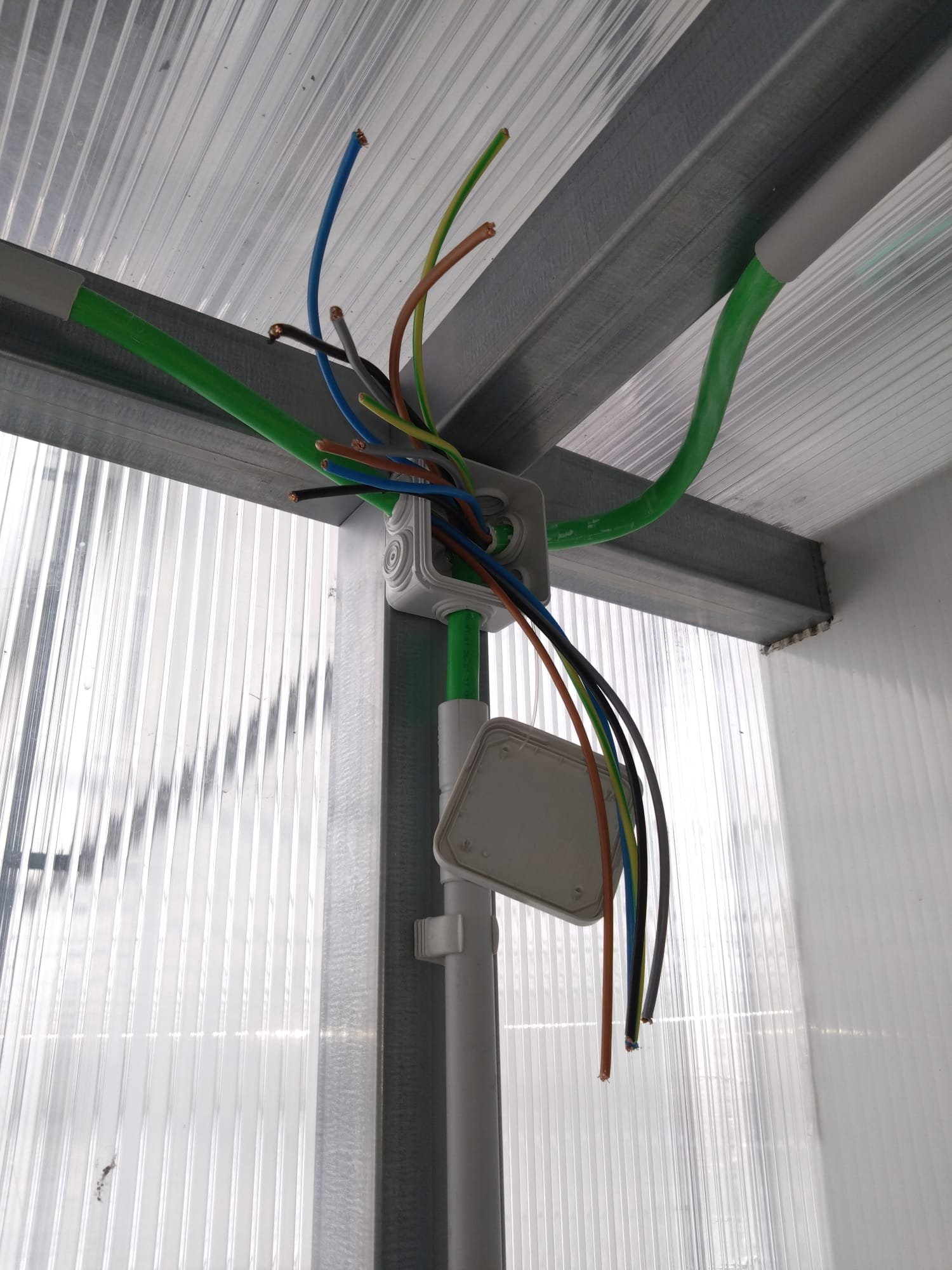 Cables pulled into a junction box, ready to connect