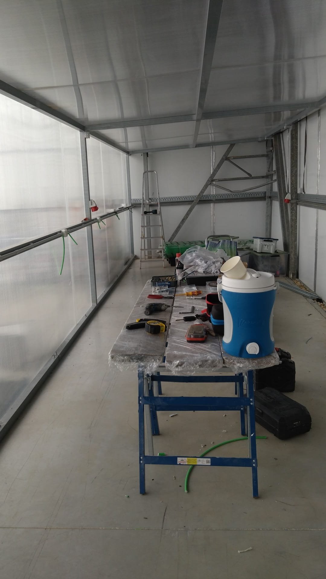 Work in progress inside the polycarbonate building, sockets fitted along the wall